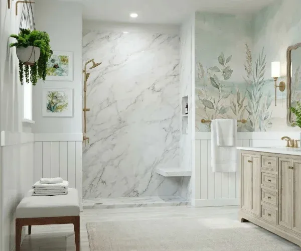 Tub-to-shower conversion with marble-look wall panels, a built-in seat and a brass handheld shower